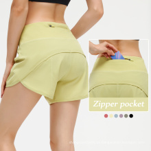 Womens por atacado executando shorts secos rápidos com shorts de bicicleta esportivos de bolso traseiro para mulheres shorts de treino feminino solto